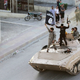 Militant Islamist fighters hold the flag of Islamic State (IS) while taking part in a military parade along the streets of northern Raqqa province in this June 30, 2014 file photo